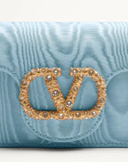 clutch-valentino-garavani-loco-in-tessuto-moire-con-logo-gioiello-dettaglio-logo